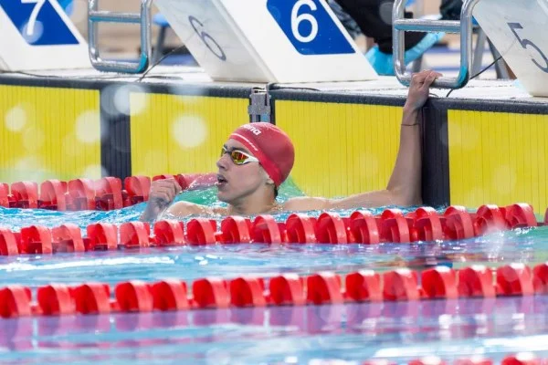 swimmer celebrating victory pool